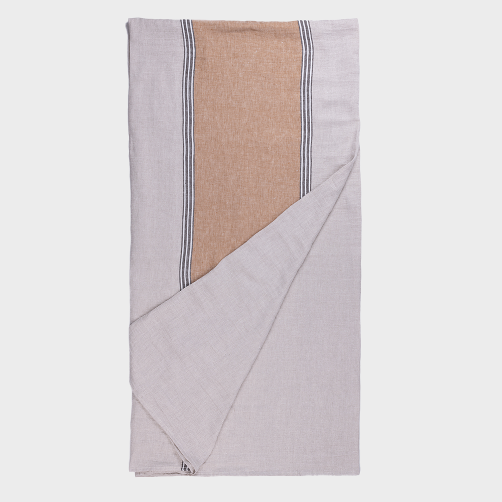 Ch1053hsth | Amity Home Folded throw blanket with a tan center panel and white and black striped edges on light gray fabric