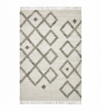 Beige woven rug with interlocking gray diamond shapes and small brown accents fringed edges top and bottom