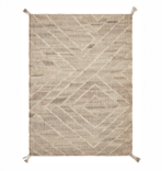 Beige woven rug with a geometric chevron and diamond pattern and tassels at the corners