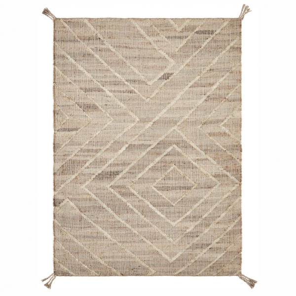 Beige woven rug with a geometric chevron and diamond pattern and tassels at the corners.