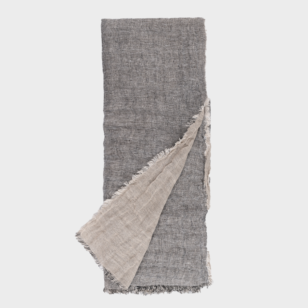Cc926asth | Amity Home Gray woven scarf with a beige underside folded diagonally across the image fringed edges visible