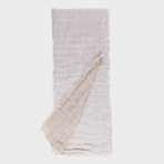 Two tone scarf with a light gray textured front and beige underside fringed edges