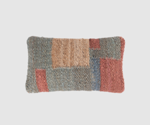 Rectangular patchwork woven pillow with blue gray red and beige blocks