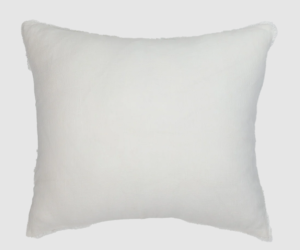 White square decorative pillow with fringe trim on a light background