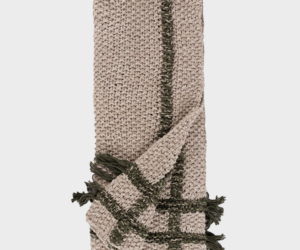 Beige chunky knit scarf with dark green stripes and tassels at the ends