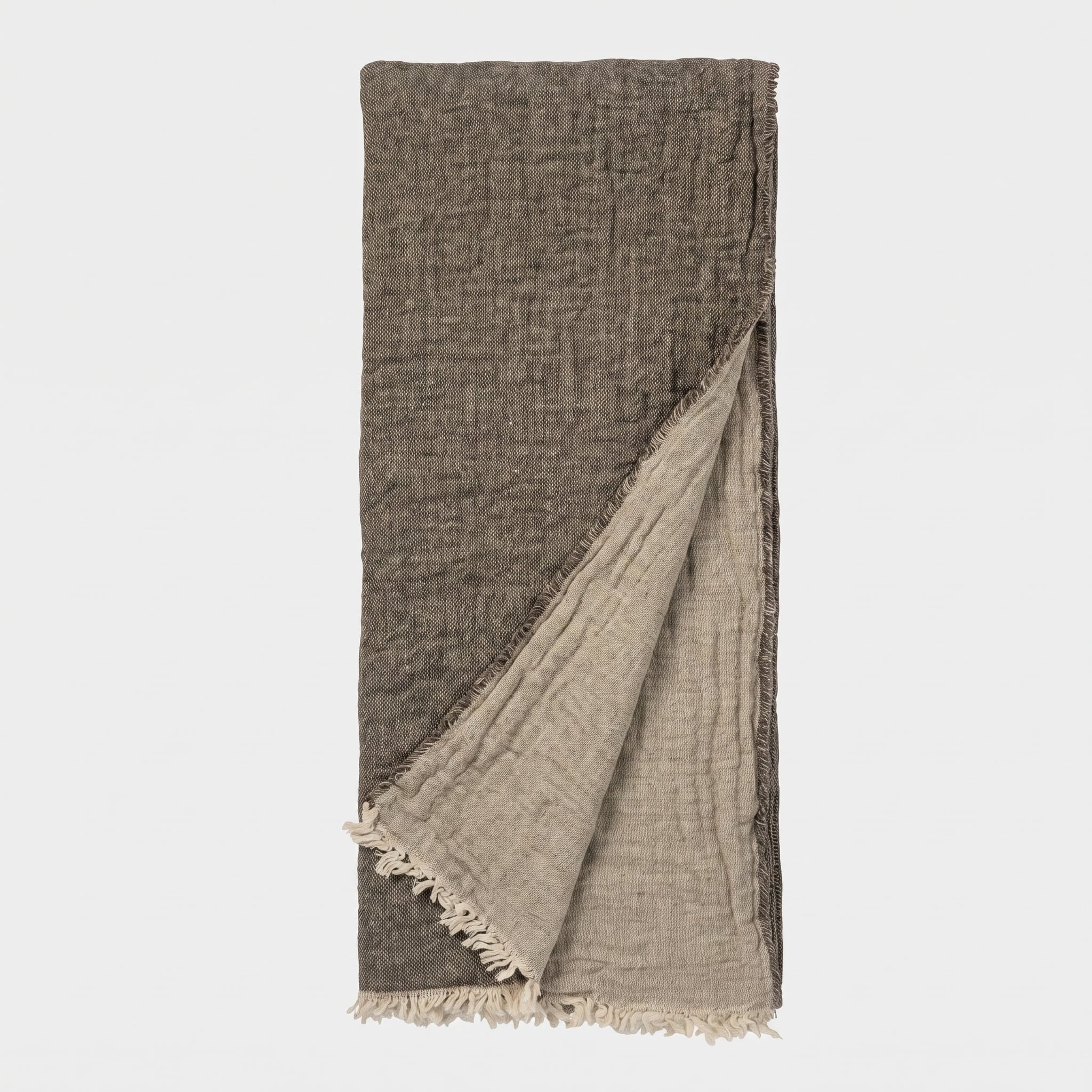 Vd101asth 2 | Amity Home Brown woven scarf with light fringe along the bottom edge hanging vertically against a pale background