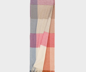 Colorful striped scarf with fringed ends folded vertically for display