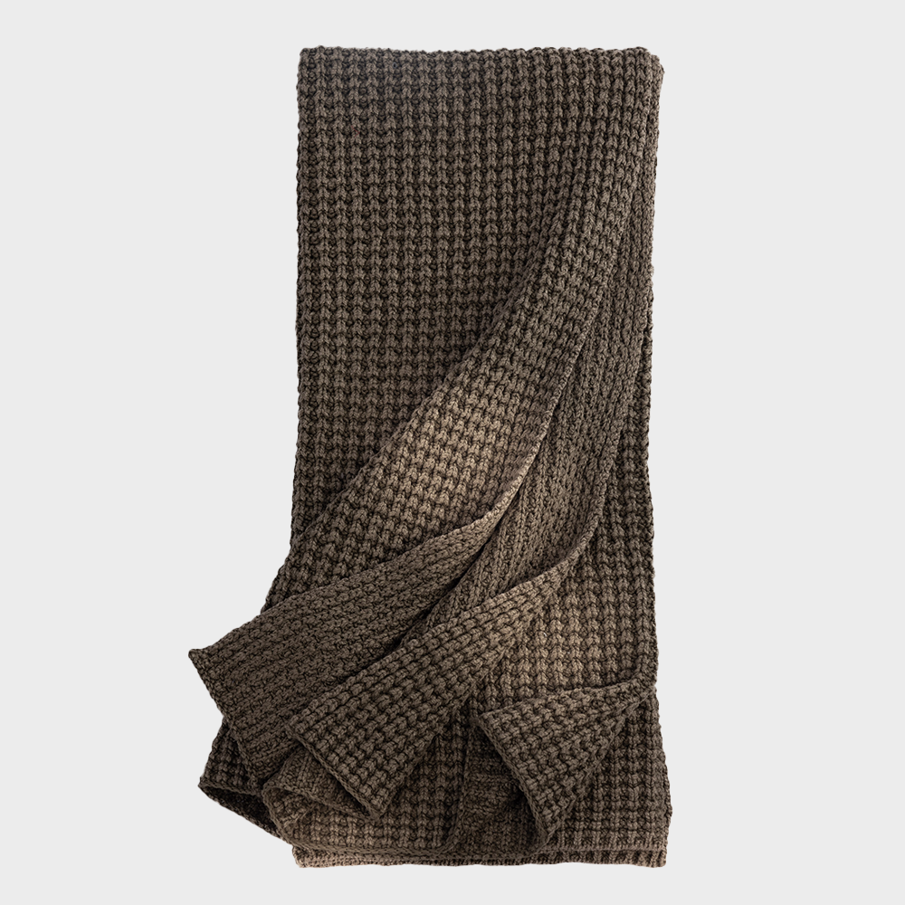 Kd2044tth | Amity Home Brown chunky knit blanket folded and draped showcasing its textured weave