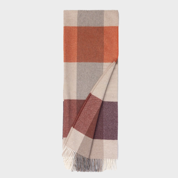 Plaid scarf with large beige, orange, gray, and burgundy blocks and fringed ends, folded for display.