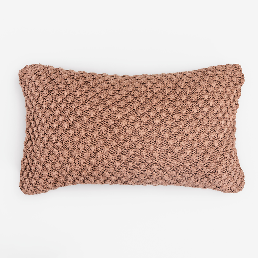 Kd2053rlb | Amity Home Dusty pink rectangular knitted throw pillow with chunky crochet texture on a white background