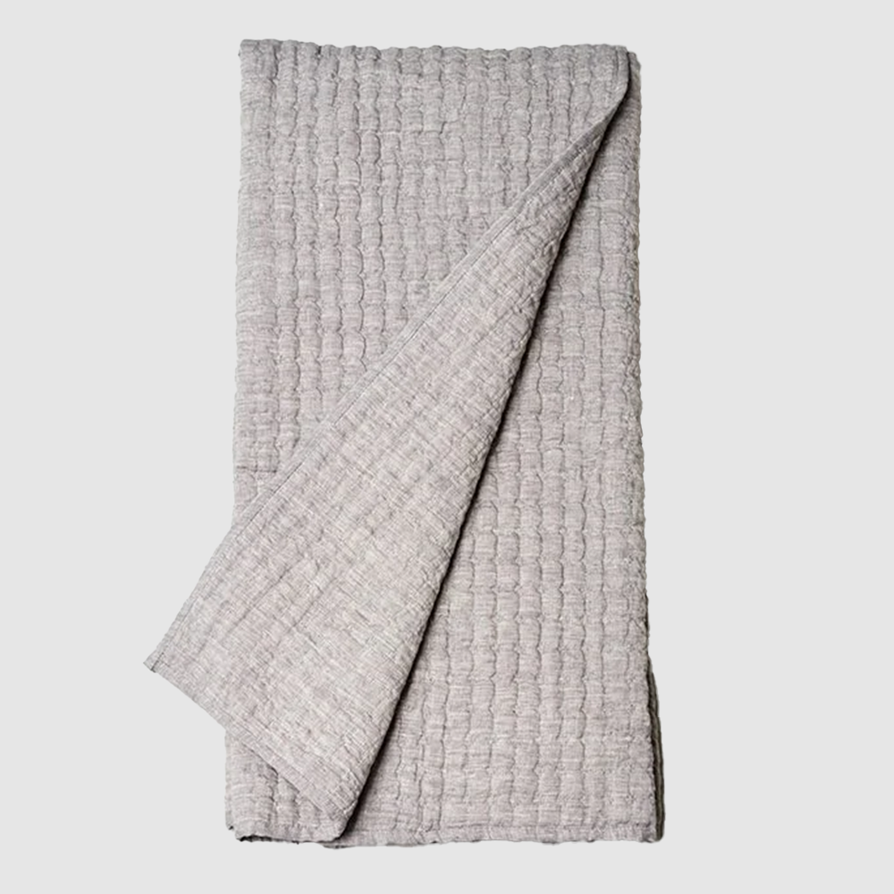 Bc603g | Amity Home Light gray textured blanket folded with one corner pulled over