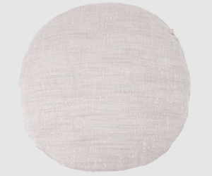 Round beige fabric pouf on a light gray background a circular floor cushion with woven texture