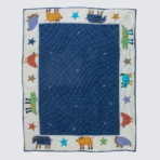 Childrens quilt with a blue inner field and an outer white border featuring colorful animal shapes and stars around the edges