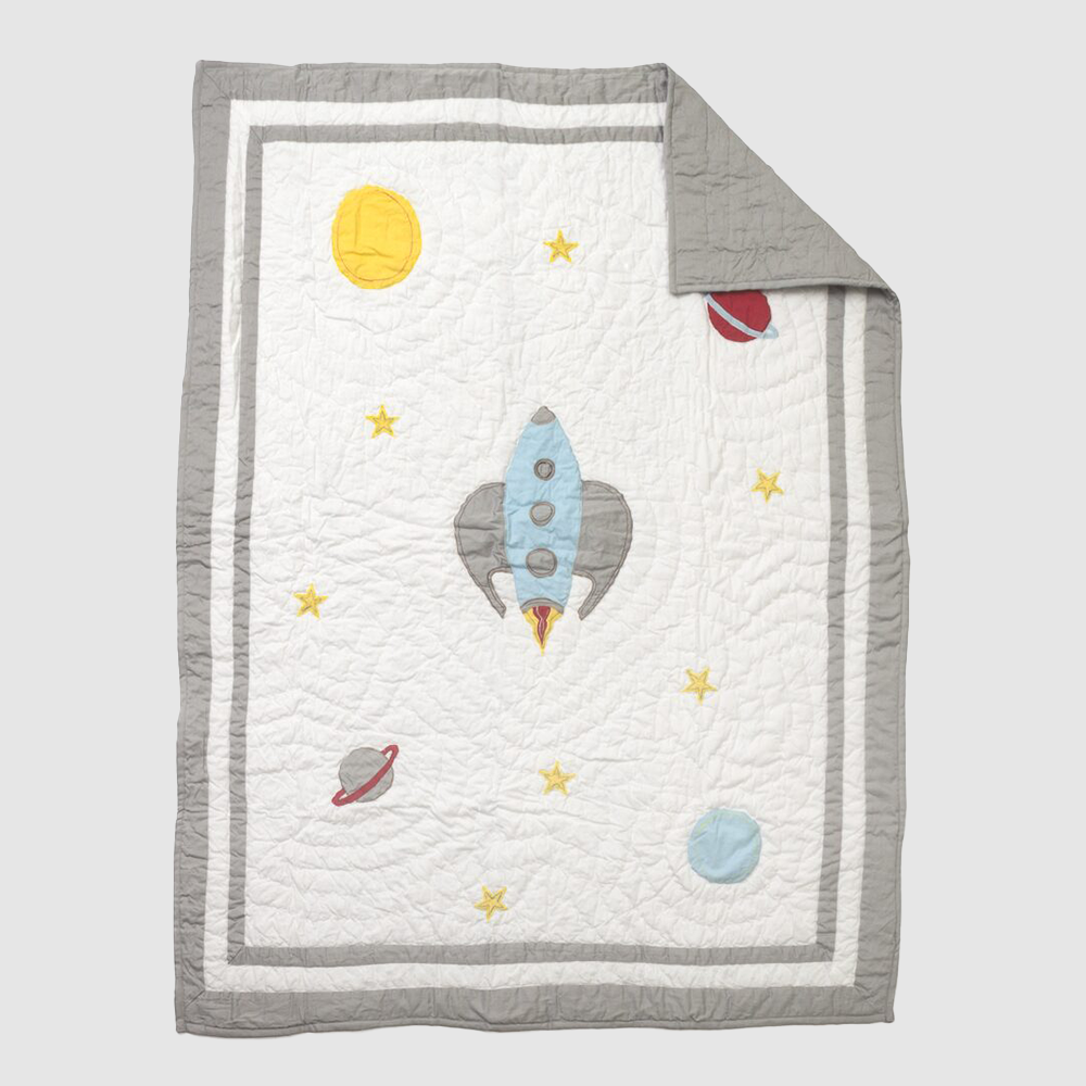 Cc887 | Amity Home Space themed quilt with a blue rocket at center yellow stars sun and planets on a white field with a gray border
