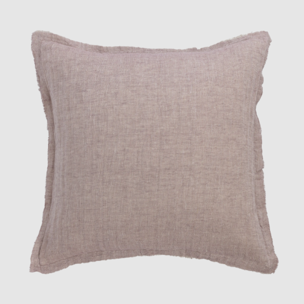 Square pink linen throw pillow with raw frayed edges on a light gray background