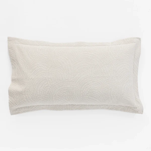Partial view of a beige textured fabric cushion with a subtle woven pattern on a white background