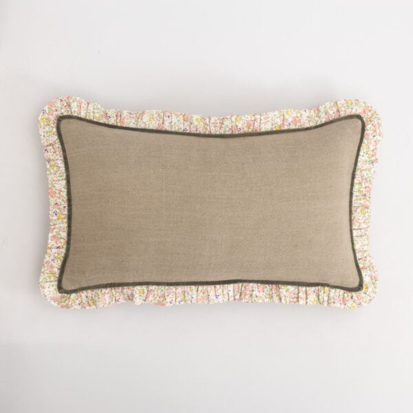 Beige fabric cushion with a floral ruffle trim against a white background.