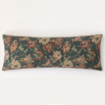 Decorative floral cushion along the bottom edge of a white wall