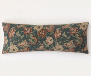 Decorative floral cushion along the bottom edge of a white wall