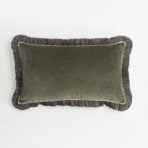 Olive green upholstered cushion with ruffled dark fabric edges on a white background