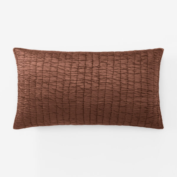 Brown quilted rectangular throw pillow on a white background
