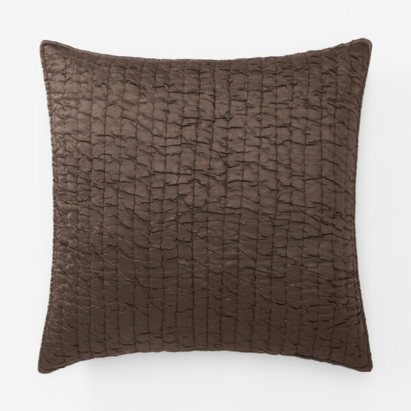 Brown quilted cushion with a textured reptile like stitching pattern on a white background