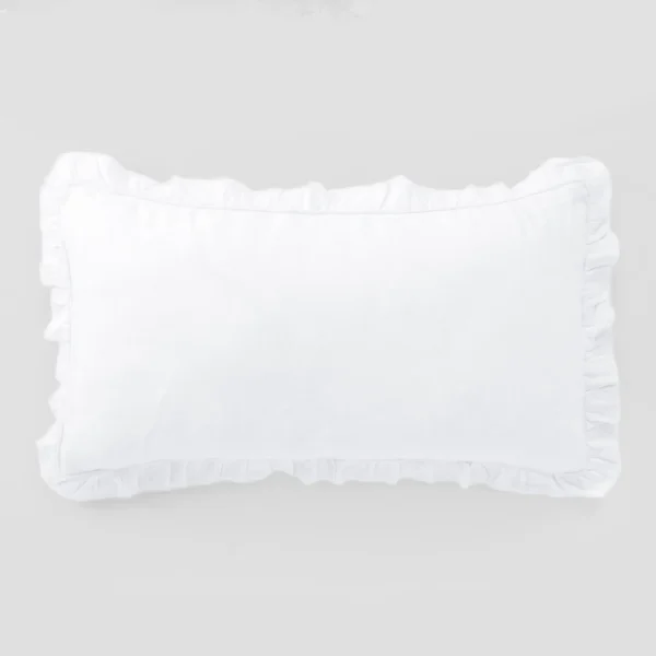 White pillow on a light gray background close up view of the cover and seams