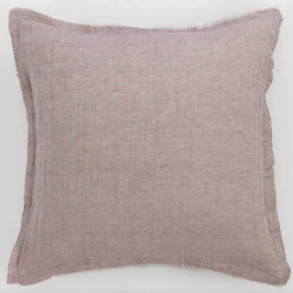 Rectangular mauve linen pillow with frayed edges on a light background