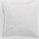 Light gray towel laid flat on a pale background with fringed edges