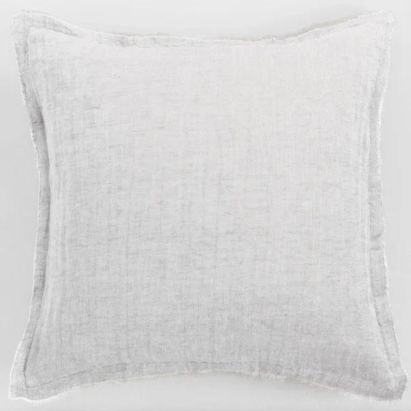 Light gray towel laid flat on a pale background with fringed edges