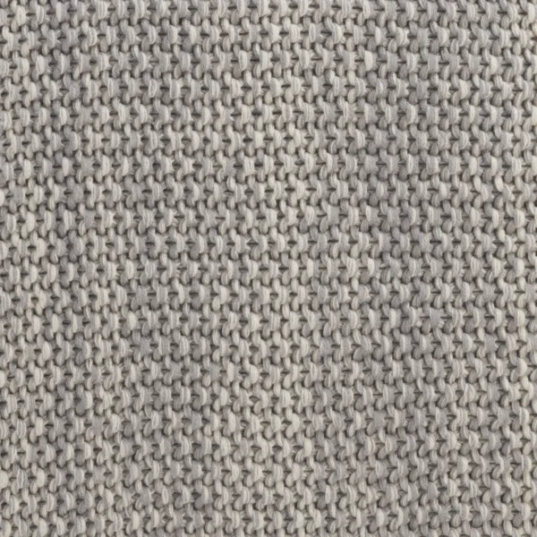 Close-up of a gray knitted fabric showing interwoven stitches.