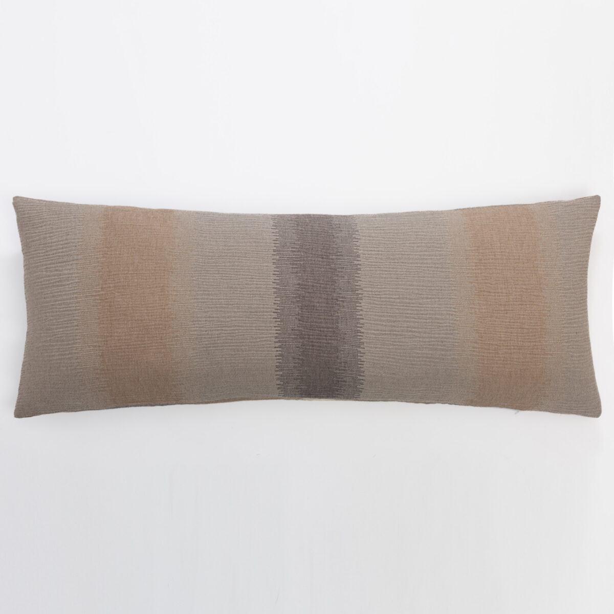 Brown woven decorative pillow with a dark vertical stripe along the center placed against a plain white background at the bottom edge of the frame