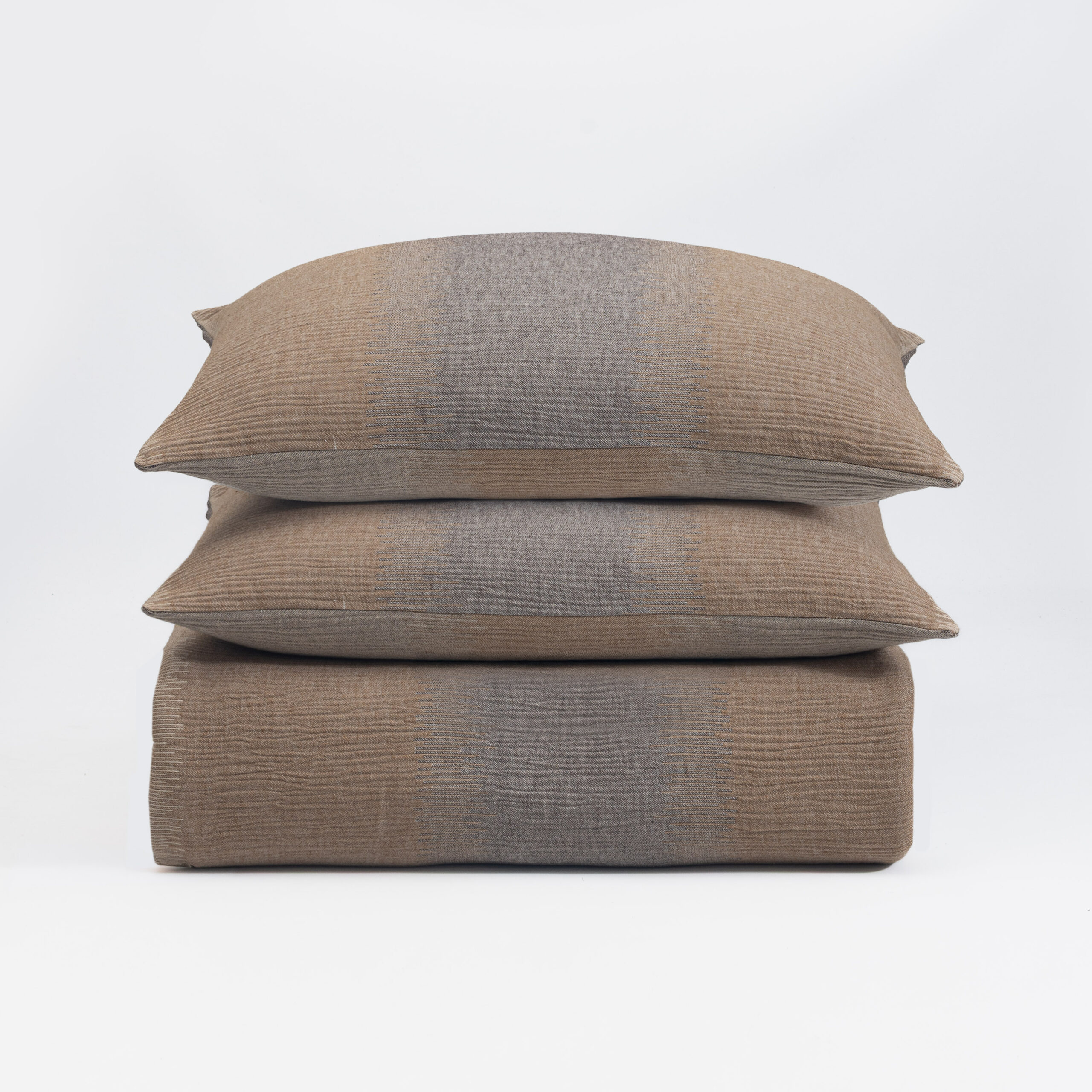 15555cmal 14 | Amity Home Three brown woven throw pillows stacked on a white background showing textured fabric and seam details down the center