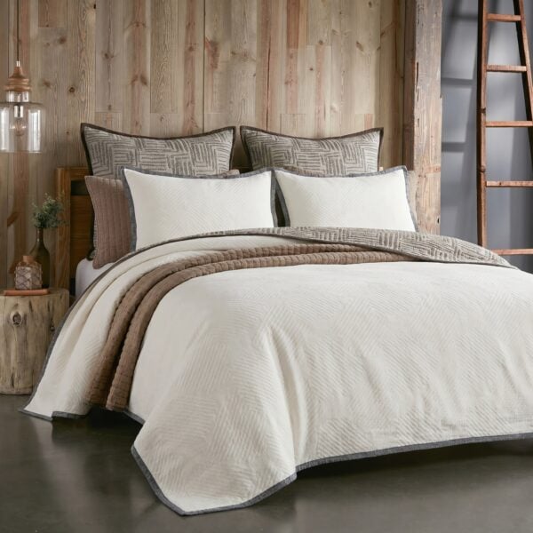 Rustic bedroom scene with a bed, neutral bedding, and a wooden paneled wall; a ladder is visible on the right side.