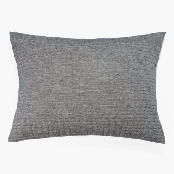 Close-up of a gray textured fabric pillow with a curved top edge against a white background.