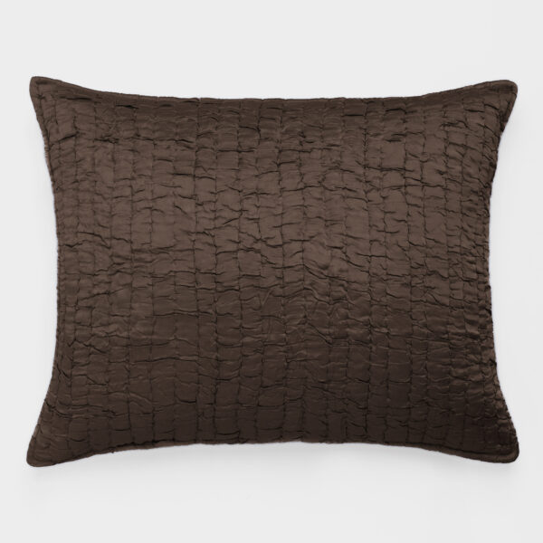Brown quilted decorative pillow photographed against a white background, showing a rectangular stitched pattern and soft texture.