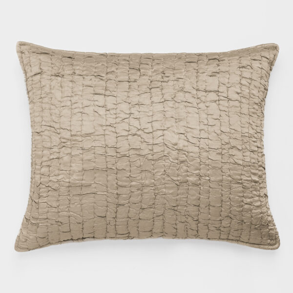 Beige textured pillow with square tufted pattern on a white background