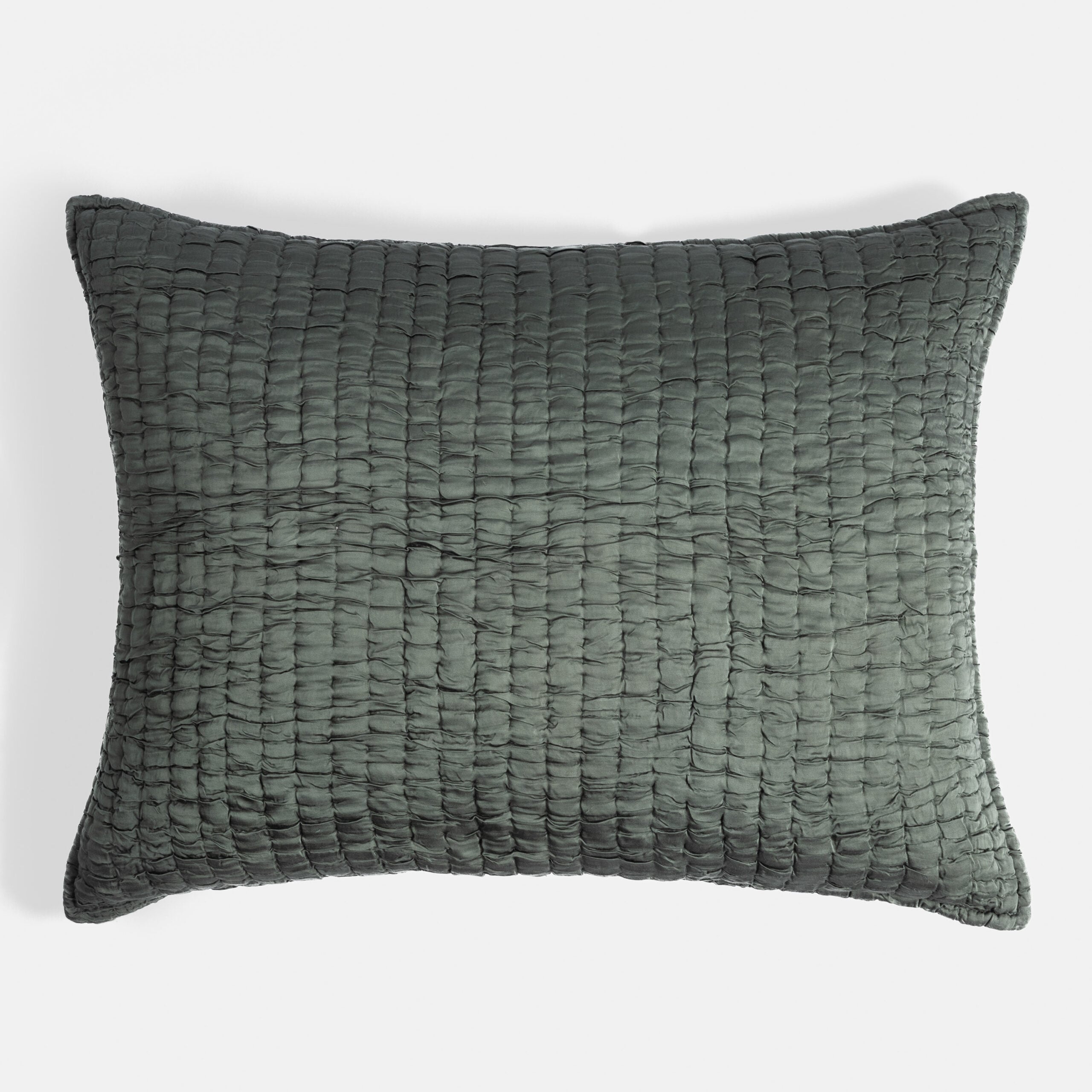 Cc776udes | Amity Home Dark green textured woven cushion with a raised grid pattern and soft edges against a light background