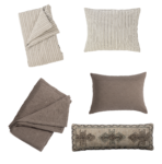 Decorative assortment of beige and taupe striped and quilted throw pillows arranged on a white background