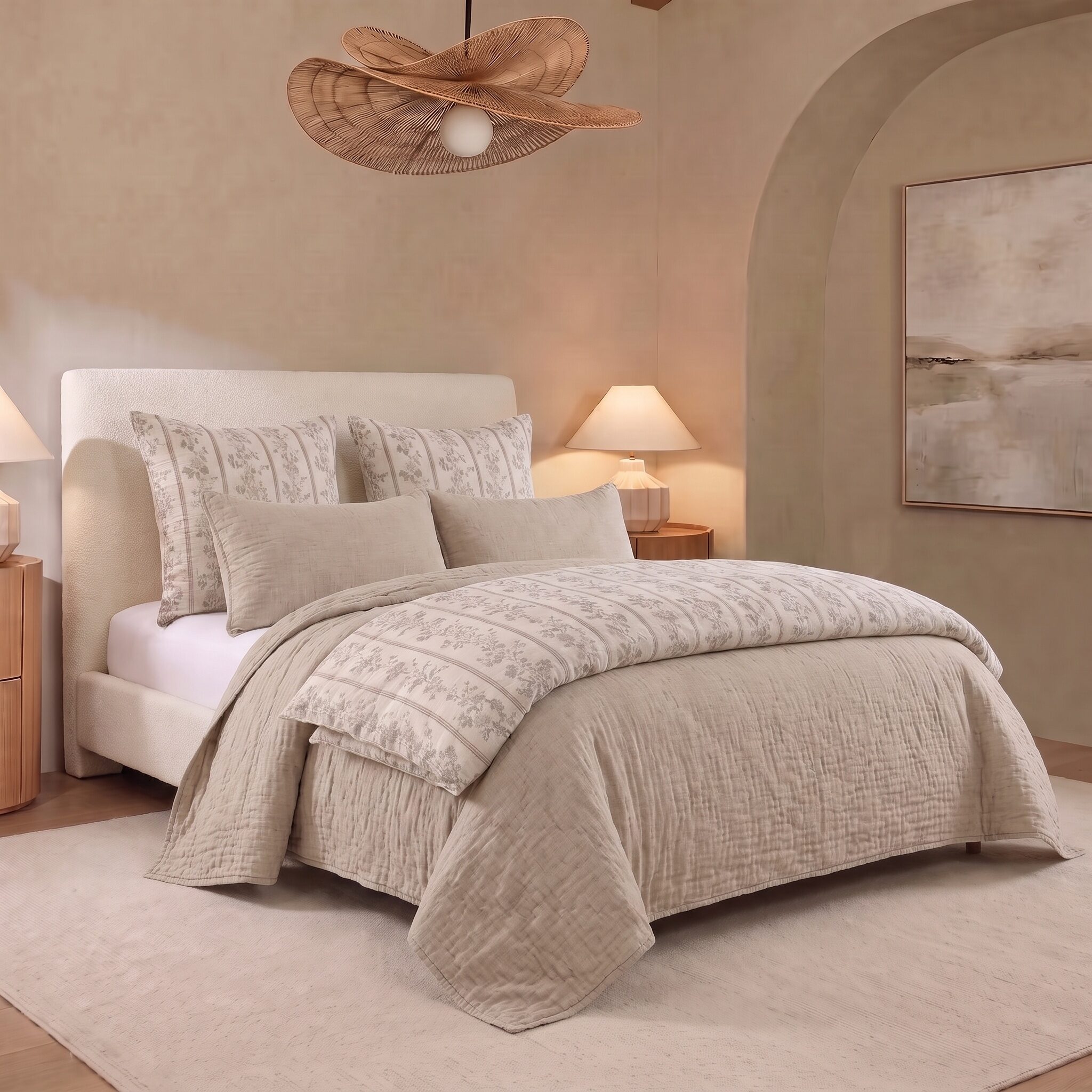Brooke Bed Pouf | Amity Home Hotel style bedroom with a cream upholstered bed patterned beige bedding and two bedside lamps