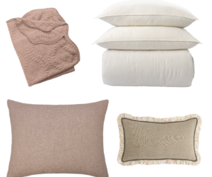 Pile of neutral pillows with a pink quilted blanket on the left against a white background