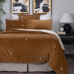 Amity home hawke quilt in ochre   velvet with knotted accents
