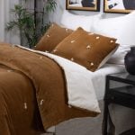 Amity home hawke quilt in ochre   tufted velvet texture