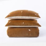 Amity home hawke quilt in ochre   velvet with tassel tufts