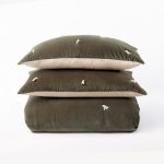 Amity home hawke quilt in laurel green   velvet with tassel details