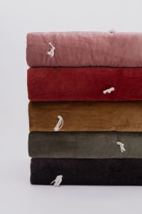 Amity home hawke quilt in brick   soft velvet with decorative ties