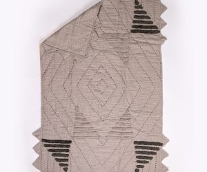 Amity home havasu baby quilt in natural taupe   textured triangle details