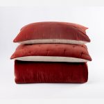 Amity home roan quilt in brick   tufted velvet texture