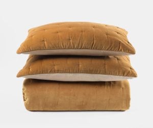 Amity home roan quilt in ochre   tufted velvet texture