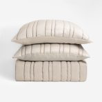 Amity home emery quilt in opal   vertical channel stitching